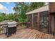Back deck featuring a grill and enclosed screened in porch area for relaxing and entertaining at 800 Isle Of Palms Ct, Fort Mill, SC 29708