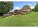 Lush backyard featuring a garden well, with lush greenery, and a back deck overlooking the backyard at 800 Isle Of Palms Ct, Fort Mill, SC 29708