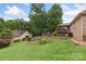 Picturesque backyard featuring a stone firepit, garden and well, perfect for relaxing and outdoor enjoyment at 800 Isle Of Palms Ct, Fort Mill, SC 29708