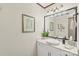Powder room with modern vanity and decorative mirror at 800 Isle Of Palms Ct, Fort Mill, SC 29708