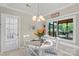 Charming dining area features a cozy table setting, bright windows, and ample natural light at 800 Isle Of Palms Ct, Fort Mill, SC 29708