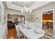 Elegant dining room featuring hardwood floors, a stylish chandelier, and a well-appointed table setting at 800 Isle Of Palms Ct, Fort Mill, SC 29708