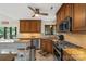 Well-lit kitchen boasts custom cabinetry, stainless steel appliances, and granite countertops at 800 Isle Of Palms Ct, Fort Mill, SC 29708
