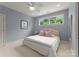 Bedroom with a cozy feel with large window and ample natural light at 8813 Covey Rise Ct, Charlotte, NC 28226