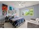 Bedroom with window view, posters on wall, and soft chair for sitting at 8813 Covey Rise Ct, Charlotte, NC 28226