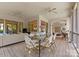 Covered patio with comfortable seating, ceiling fans, and a dining area perfect for outdoor gatherings at 8813 Covey Rise Ct, Charlotte, NC 28226