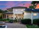 Elegant home exterior with screened porch, multiple windows and a beautiful landscaped yard at 8813 Covey Rise Ct, Charlotte, NC 28226