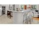 Bright kitchen features marble countertops, white cabinets, and stainless steel appliances at 8813 Covey Rise Ct, Charlotte, NC 28226