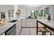 Modern kitchen with white cabinets, granite countertops, stainless steel appliances and ample natural light at 8813 Covey Rise Ct, Charlotte, NC 28226