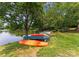Collection of kayaks and canoes by the lakeside, offering recreational opportunities by the water at 8813 Covey Rise Ct, Charlotte, NC 28226