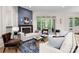 Stylish living room with a fireplace, hardwood floors, and elegant furnishings, perfect for relaxing and entertaining at 8813 Covey Rise Ct, Charlotte, NC 28226