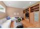Cozy living room with built-in shelving, hardwood floors, and a comfortable sectional sofa at 8813 Covey Rise Ct, Charlotte, NC 28226