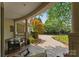 Cozy outdoor sitting area with comfortable furniture and views of the well-manicured front yard and driveway at 8813 Covey Rise Ct, Charlotte, NC 28226