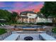Gorgeous home exterior featuring a luxurious pool, spa, and lounge area for outdoor relaxation at 8813 Covey Rise Ct, Charlotte, NC 28226