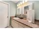 This bathroom features a sink with an elegant countertop, cabinets, and a unique mirror setup at 8968 St Croix Ln, Charlotte, NC 28277