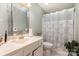 This bathroom has a neutral color scheme, toilet, and a well-lit sink with cabinets at 8968 St Croix Ln, Charlotte, NC 28277