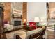 Comfortable living room with stone fireplace, wood accents, and ample seating arrangements perfect for relaxation at 8968 St Croix Ln, Charlotte, NC 28277