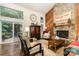 Bright living room with high ceilings, a fireplace, and sliding glass doors to the deck at 8968 St Croix Ln, Charlotte, NC 28277