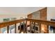 A living room featuring stone fireplace, wood paneling, and natural light at 8968 St Croix Ln, Charlotte, NC 28277