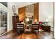 Inviting living room featuring a striking stone fireplace, wood paneling, and abundant natural light at 8968 St Croix Ln, Charlotte, NC 28277