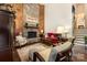 Cozy living room with stone fireplace and wood accent wall creating a warm ambiance at 8968 St Croix Ln, Charlotte, NC 28277