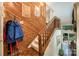 Stairway featuring wood paneling, a carpeted staircase, and stylish decor leading to upper level at 8968 St Croix Ln, Charlotte, NC 28277