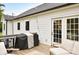 Inviting back deck with white cushioned furniture and outdoor string lights at 943 Shinnville Rd, Mooresville, NC 28115