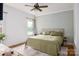 Spacious bedroom with large window and a ceiling fan at 943 Shinnville Rd, Mooresville, NC 28115