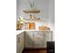Kitchen detail featuring wooden floating shelves and modern hardware on white cabinets at 943 Shinnville Rd, Mooresville, NC 28115
