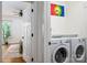 Convenient laundry room with modern washer and dryer adjacent to the Primary bedroom at 943 Shinnville Rd, Mooresville, NC 28115