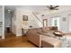 Open-concept living room with hardwood floors and a large sectional sofa at 943 Shinnville Rd, Mooresville, NC 28115