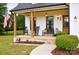 Inviting front porch with rocking chairs and a charming entrance at 943 Shinnville Rd, Mooresville, NC 28115