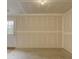 Unfinished basement with painted walls awaits personalization, featuring convenient door access at 954 Taybyn Rd, Fort Mill, SC 29715