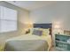 Comfortable bedroom with natural light, queen bed, and a nightstand with decorative accents at 954 Taybyn Rd, Fort Mill, SC 29715