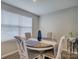 Bright dining area features a round table with upholstered chairs and a large window at 954 Taybyn Rd, Fort Mill, SC 29715