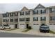 A view of the townhome complex featuring individual garages and covered front door entries at 954 Taybyn Rd, Fort Mill, SC 29715