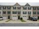 A view of the townhome complex featuring individual garages and covered front door entries at 954 Taybyn Rd, Fort Mill, SC 29715