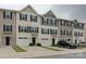 A view of the townhome complex featuring individual garages and covered front door entries at 954 Taybyn Rd, Fort Mill, SC 29715