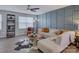 Stylish living room featuring a ceiling fan, modern decor, and ample natural light at 954 Taybyn Rd, Fort Mill, SC 29715