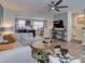 Cozy living room features modern decor, stylish furniture, ceiling fan, and hardwood floors at 954 Taybyn Rd, Fort Mill, SC 29715