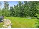Expansive backyard with well-maintained lawn and landscaping at 9833 Ardley Park Way, Mint Hill, NC 28227