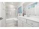 Elegant bathroom featuring a marble tiled shower, white cabinets, and stylish fixtures, offering a spa-like experience at 9833 Ardley Park Way, Mint Hill, NC 28227