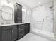 Well-lit bathroom featuring a double vanity and a glass-enclosed shower at 9833 Ardley Park Way, Mint Hill, NC 28227