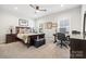 Comfortable bedroom with a ceiling fan and a study desk at 9833 Ardley Park Way, Mint Hill, NC 28227