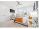 Comfortable bedroom with ceiling fan, mirrored nightstands, and a sunny window, perfect for relaxation at 9833 Ardley Park Way, Mint Hill, NC 28227