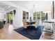Formal dining room with a table with six chairs, window and stylish lighting fixture at 9833 Ardley Park Way, Mint Hill, NC 28227