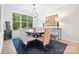 Formal dining room with large window and a stylish chandelier at 9833 Ardley Park Way, Mint Hill, NC 28227