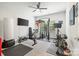 A well-equipped home gym with exercise machines and a TV at 9833 Ardley Park Way, Mint Hill, NC 28227