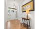 Elegant foyer with hardwood floors, a decorative table, and a view of the bright, welcoming entryway at 9833 Ardley Park Way, Mint Hill, NC 28227
