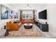 Cozy living room with comfortable seating, movie posters, and a ceiling fan at 9833 Ardley Park Way, Mint Hill, NC 28227